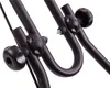 Close-up of black metal parts with knobs and bolts, likely from a piece of machinery or equipment. Produktbild-Vorschau