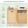 A bamboo laundry cabinet with two compartments, shown with towels and toiletries on top, and icons highlighting product features on the left. Podgląd zdjęcia produktu