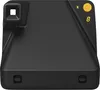 A black Polaroid camera is shown from a front-facing, slightly elevated angle against a white background. Voir les images du produit