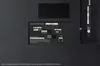 The back panel of a television showing various ports and connections. Produktbild-Vorschau