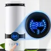 A close-up shot of a white humidifier with a blue digital display, showing temperature and humidity readings. A finger is shown pressing a button on the humidifier. Voir les images du produit