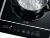 A close-up of an induction cooktop with a pot of boiling water on it. The control panel of the cooktop is visible. Náhľad obrázku produktu
