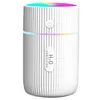 A white humidifier with colorful LED lights at the top. Produktbild-Vorschau