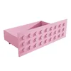 A pink drawer with a Lego-like design on a white background. Anteprima dell’immagine prodotto