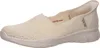 A side view of a single cream-colored Skechers slip-on shoe. Produktbild-Vorschau