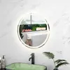 A bathroom scene featuring a round LED mirror above a green sink with a faucet and a plant. Produktbild-Vorschau