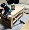 A person is holding a cordless vacuum cleaner and vacuuming a rug in a living room setting. Podgląd zdjęcia produktu