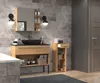A modern bathroom vanity and storage cabinet with a dark sink and wooden accents. Voir les images du produit
