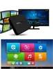 A black MXQ 4K Android TV box is displayed in front of a television screen, with film strips on the left. The bottom of the image shows a tablet interface with various app icons. Náhled obrázku produktu