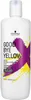 A white bottle of Schwarzkopf Professional Goodbye Yellow shampoo with purple and yellow abstract paint splatters. Voir les images du produit