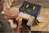A person is organizing small containers within a tool box. Voir les images du produit