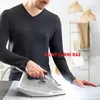 A man is ironing clothes with a Tefal iron. Produktbild-Vorschau
