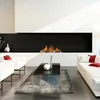 A modern living room with a fireplace, sofas, and a coffee table. Produktbild-Vorschau