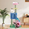 A cat tree with multiple levels and platforms, featuring two cats interacting with it, set in a home environment with a plant and furniture in the background. Podgląd zdjęcia produktu