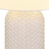Close-up of a table lamp base with a textured glass design. Anteprima dell’immagine prodotto