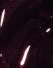 A close-up abstract view of a dark, glittery substance with streaks of white light. Náhled obrázku produktu
