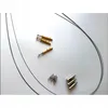 A collection of acoustic panel mounting hardware and wires laid out on a white surface. Podgląd zdjęcia produktu