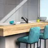 A modern kitchen counter with a sink, faucet, and bar stools. Náhled obrázku produktu
