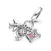 A close-up studio shot of a silver charm bracelet with three dangling charms: an airplane, a globe, and a suitcase with a pink heart and airplane design. Podgląd zdjęcia produktu