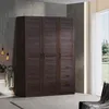A dark wood wardrobe with louvered doors and drawers is shown in a room with a window and a chair. Produktbild-Vorschau