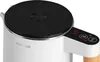 A close-up shot of the top and side of a white electric kettle with a black lid and a digital display showing '49'. Produktbild-Vorschau
