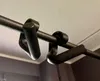 Close-up of black pull-up bar grips attached to a metal bar. Náhľad obrázku produktu