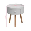 A white round bedside table with wooden legs and a single drawer, shown from the front with dimensions indicated. Anteprima dell’immagine prodotto