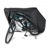 A bicycle covered by a black protective cover. Produktbild-Vorschau