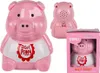 A pink plastic pig-shaped product with a white shirt and red lettering, shown from the front, back, and in its packaging. Podgląd zdjęcia produktu