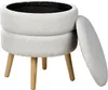 A white bouclé ottoman with wooden legs, the lid is partially open. Náhled obrázku produktu