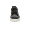 A front view of a black leather sneaker with white soles and black laces, set against a white background. Produktbild-Vorschau