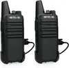 Two black Retevis RT622 walkie-talkies are shown side-by-side, each connected to a charging cable. Náhľad obrázku produktu
