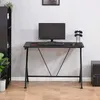 A computer desk setup in a room with a bookshelf and a computer tower. Podgląd zdjęcia produktu