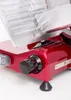 A close-up view of a red meat slicer, focusing on the adjustment knob and blade guard. Náhled obrázku produktu