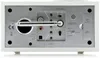 The back panel of a white radio with various ports and an extended antenna. Produktbild-Vorschau