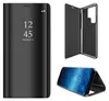 A black flip case for a Samsung Galaxy S23 Ultra phone, shown from multiple angles, including a closed view with a clear display, an open view showing the case's interior, and a phone inside the case. Produktbild-Vorschau
