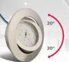 A close-up of a dimmable LED recessed spotlight with a brushed nickel finish, showing its adjustable angle. Produktbild-Vorschau