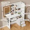A white vanity table with a mirror and drawers, filled with cosmetics and accessories, placed in a bedroom setting. Produktbild-Vorschau