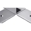 Three silver MacBooks are arranged in a triangular formation on a white background. Náhľad obrázku produktu