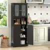 A dark brown kitchen cabinet with glass doors is shown in a kitchen setting, with a window and a bag of groceries nearby. Náhľad obrázku produktu