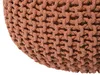 A close-up view of a knitted pouf. Produktbild-Vorschau