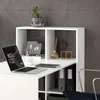 A white desk with a laptop, plant, and office supplies, set against a textured gray wall. Podgląd zdjęcia produktu