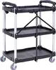 A black three-tier folding utility cart with silver legs and grey wheels, shown against a white background. Voir les images du produit