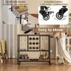 A person is using a rolling kitchen cart in a room. Podgląd zdjęcia produktu