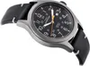 A close-up, angled shot of a Timex Expedition watch with a black dial and a black leather strap, set against a white background. Produktbild-Vorschau