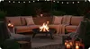 An outdoor patio at night with a fire pit, seating, and string lights. Náhľad obrázku produktu