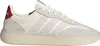 A side view of a white Adidas sneaker with red accents. Produktbild-Vorschau