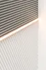 A close-up view of a textured wall panel with a light strip. Náhľad obrázku produktu