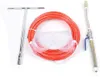 A collection of tools for concrete crack repair, including a T-handle wrench, a coiled orange hose, safety goggles, and a grouting gun. Náhled obrázku produktu