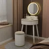 A vanity table with a mirror and stool in a bedroom setting. Podgląd zdjęcia produktu